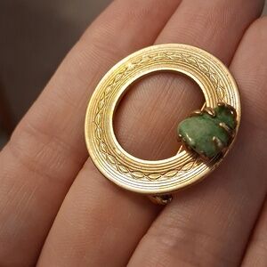 Gold-Tone Circular Brooch with Green Stone Accent